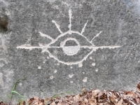 Eyeball/sunrise. Chicago lakefront stone carvings, Promontory Point. 2025