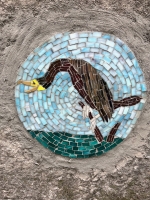 Bird mosaic, detail, on verso of mosaic rock.  Mosaic made 2022.  Promontory Point. 2022
