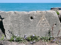 Waves, Izzard pyramid, made during May 28, 2022, carving day. Level 5, vertical. Chicago lakefront stone carvings, Promontory Point. 2023