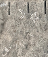 Eyeball, moon and star made at May 2023 carving workshop. Level 5. Chicago lakefront stone carvings, Promontory Point. 2023