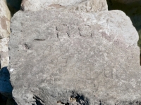 R.C., HA(?). EI, CM. Chicago Lakefront stone carvings, south of La Rabida Hospital. 2025