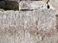 J, R.J.I., BM, CK, UF, R (detail), heart. Chicago Lakefront stone carvings, south of La Rabida Hospital. 2025