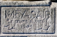 M.F. Adair, Le Temps Reviem, 1948, from 12-panel carving. "Le Temps Revient" was Lorenzo de' Medici's motto, meaning something like "the time comes again." It appears to be misspelled here.  M.F. Adair was, I presume, the creator of this masterpiece. Chicago Lakefront stone carvings, south of La Rabida Hospital. 2025