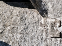 Jake, Fuck, Jim, V, deep cut shapes, C. Fogle (detail). Chicago Lakefront stone carvings, south of La Rabida Hospital. 2025