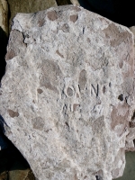 Decayed name, Aug 29 3?, JC. Chicago Lakefront stone carvings, south of La Rabida Hospital. 2025
