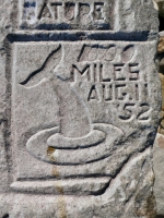 1000 Miles Aug 11 1952, diving whale, from 12-panel carving. Chicago Lakefront stone carvings, south of La Rabida Hospital. 2025