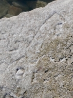 Autograph rock: ME, Squirrel (detail), S, UL, Randy, KT, F.B., Jim, OHS x MAT, 77, others. Chicago Lakefront stone carvings, south of La Rabida Hospital. 2025