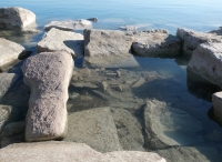 Priapic figure (submerged) and partial female figure. Chicago Lakefront stone carvings, south of La Rabida Hospital. This and other carvings were submerged just a couple of years prior when lake levels were higher. 2025