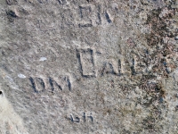 Autograph rock detail: J, JO, Chuck W, J, A S(?)rtich, SK, DM, Daly, 47, SHE, EJ. Chicago Lakefront stone carvings, south of La Rabida Hospital. 2025