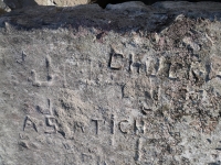 Autograph rock detail: J, JO, Chuck W, J, A S(?)rtich, SK, DM, Daly, 47, SHE, EJ. Chicago Lakefront stone carvings, south of La Rabida Hospital. 2025