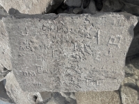 Autograph rock: J, JO, Chuck W, J, A S(?)rtich, SK, DM, Daly, 47, SHE, EJ, BH. Chicago Lakefront stone carvings, south of La Rabida Hospital. 2025