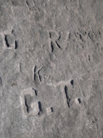 Autograph rock detail: JI, Bob, K, G.T., C, Ray, Babe, W, K, Shorty, Pegleg, Bart, Ray, others. Chicago lakefront stone carvings, south of La Rabida Hospital. 2025