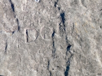 Swastika, Don R. (detail). Chicago Lakefront stone carvings, south of La Rabida Hospital. 2025