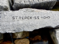 Strepek 55, infinity, detail. Chicago lakefront stone carvings, Rainbow Beach. 2019