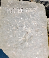 64 65 Polecats, 95, faint letters along right edge of rock. Chicago lakefront stone carvings, Rainbow Beach jetty. 2022