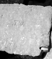 J.V., Dennie(?) G Ann W 69, cross with indecipherable letters. Chicago lakefront stone carvings, Rainbow Beach jetty. 2022