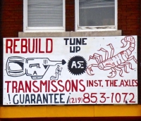 Cabrales Auto Repair, sign with transmission and scorpion