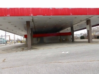 Dead gas station from edge of overhang