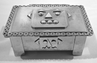 Stanley Szwarc stainless steel small face box  with robot-like face, front view