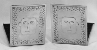 Stanley Szwarc stainless steel bookends with faces