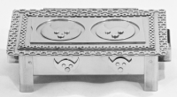 Stanley Szwarc stainless steel face box with two bat-like faces, front view