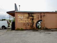 Half a painted tire on wall, Llantera Latino Americana, Nolansville Pike, Nashville-Roadside Art