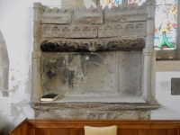 Another Tuberville family tomb in St. John the Baptist Church, Bere Regis, with the Tuberville window behind it. The plaque on the right is dated 1559