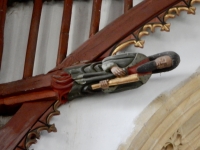 Saint on the 15th century roof, St. John the Baptist Church, Bere Regis, England