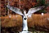 Wickham's angel in the family cemetery circa 1993. The cemetery and the angel have been cleaned up.