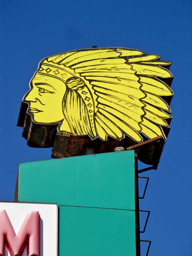 Indian chief head atop sign for Apache Motel, Chicago