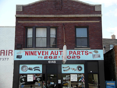 Hand-painted auto parts on the Ninevah Auto Parts storefront, Chicago-roadside art
