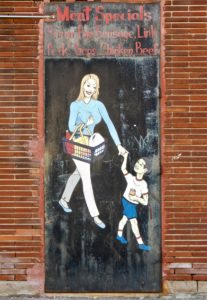 Woman child from the outdoor art gallery at Las Americas Food and Liquor