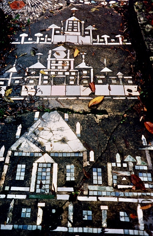 Buildings embedded in the sidewalk at Howard Finster's Paradise Garden, circa 1990